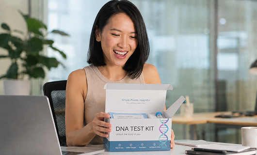 An employee opening her sponsored DNA test kit.